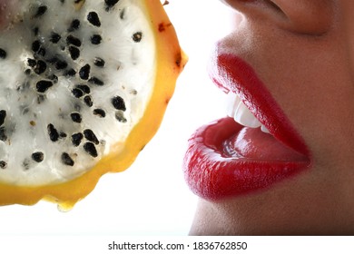 Beautiful Red Lips Biting A Fruit