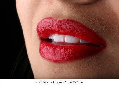 Beautiful Red Lips Biting A Fruit