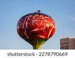 A beautiful red rose flower design on a water tower in Rosemont, Illinois.