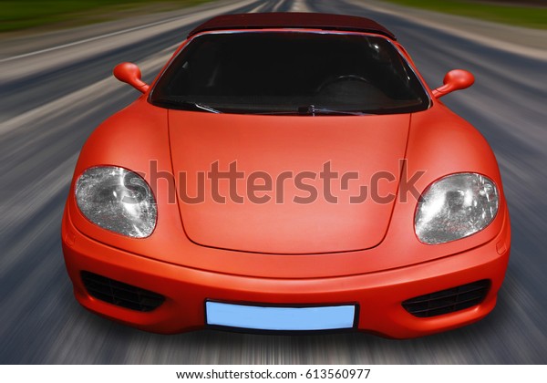beautiful red sports car\
rushes on road