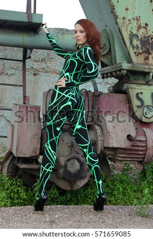 Beautiful RedHead Photomodel Posing In Comet Style Futuristic Green Catsuit