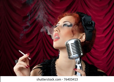 Beautiful Redhead Woman Smoking Cigarette Near Vintage Microphone