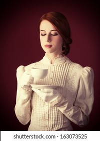 Beautiful Redhead Women With Cup Of Tea