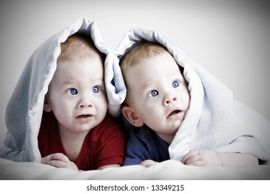 Beautiful Redheaded Twin Babies Under Blanket