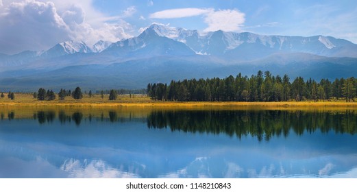 Beautiful reflection of mountain peaks in the lake