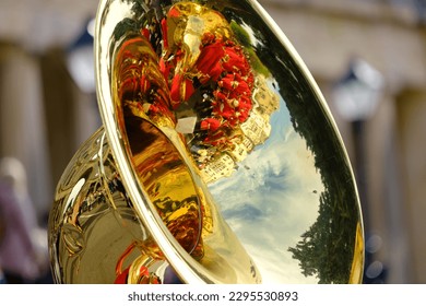 Beautiful reflections of the surroundings in the Tubas of Colorful Philharmonic Orchestras during the famous Easter Litany Processions - Shutterstock ID 2295530893