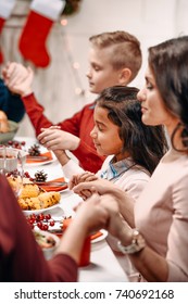 Beautiful Religious Family Praying Before Christmas Dinner