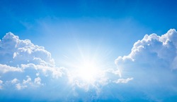 Beautiful Religious Image - Bright Light From Heaven, Light Of Hope And Happyness From Skies. Sun Shines In Blue Sky Above White Clouds.