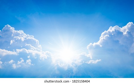 Beautiful religious image - bright light from heaven, light of hope and happyness from skies. Sun shines in blue sky above white clouds. - Shutterstock ID 1825158404