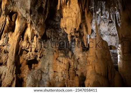 A beautiful Resava cave in Serbia,  massive columns of stalagmites and stalactites and colonnades to small tubs with pearls on the cave bottom. morphological, hydrographic and microclimatic features
