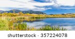 A beautiful reservoir in autumn fields at the foot of the Bridger mountain range in Cherry Creek Nature Preserve on the outskirts of Bozeman, Montana
