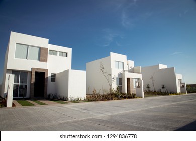 Beautiful Residential With New And Spacious Homes To Live. Sunny Day, Grass And Blue Sky.