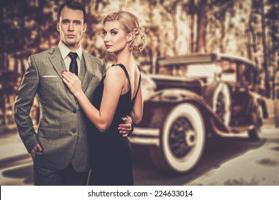 Beautiful retro couple against vintage car - Powered by Shutterstock