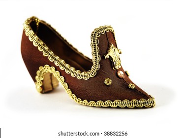 Beautiful Retro Princess Shoe On A Heel Embroidered With Gold Ribbon Isolated On White