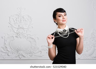 Beautiful Retro Woman With Pearls Necklace At Luxury Interior