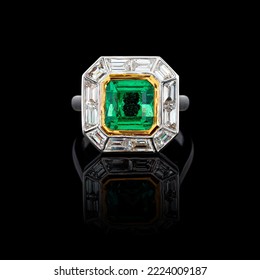 beautiful ring made of gold with precious stones emerald and diamonds on a black background close-up - Shutterstock ID 2224009187
