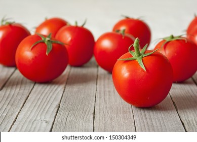 beautiful ripe tomatoes on wood surface - Powered by Shutterstock