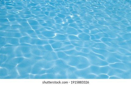Beautiful ripple wave and blue water surface in swimming pool. Blue water surface background