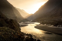 Beautiful River Landscape With High Mountains Peaks On Sunrise. Pakistan.