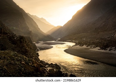 Beautiful river landscape with high mountains peaks on sunrise. Pakistan. - Powered by Shutterstock