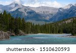 Beautiful river in the mountians with forests surrounding it