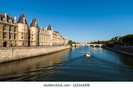 The Beautiful River Seine In Paris, France With Boat Cruising By.