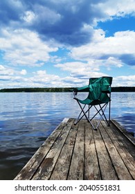 Beautiful River View With A Fishing Chair On The Pier That Can Be Used As A Mockup