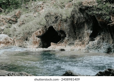 Beautiful river views with rocky banks, clear water flowing fast - Powered by Shutterstock