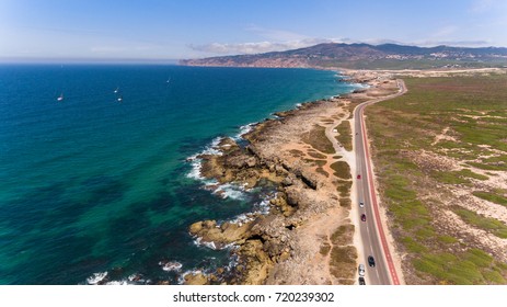 Beautiful Road Along The Coast Of Ocean On Sunny Day, Portugal Aerial View From Drone