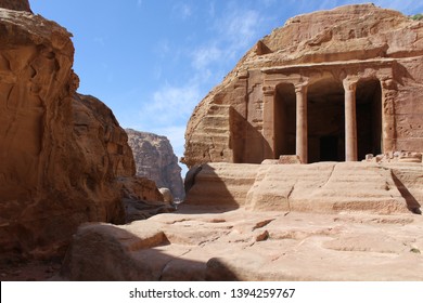 Beautiful rock-carved Garden Triclinium facade on the scenic mountain trail to the High Place of Sacrifice via Wadi Farasa in a famous historical and archaeological city of Petra, Wadi Musa, Jordan