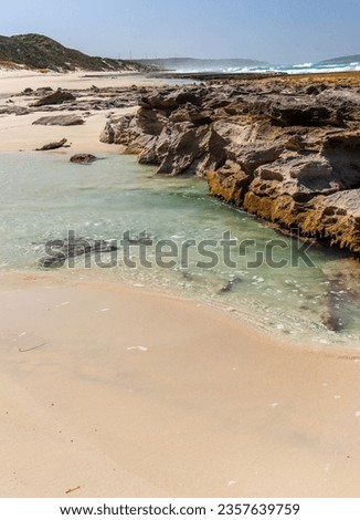 Beautiful rocky beach at low tide showing reef. 11 Mile beach, Esperance Western Australia.