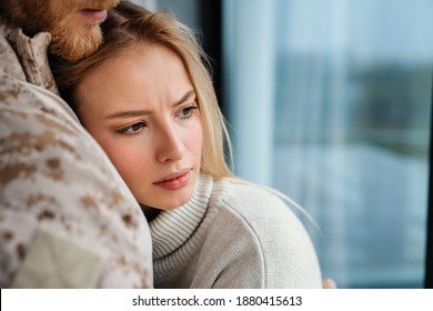 Beautiful Romantic Couple Hugging While Standing Near Window Indoors