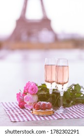 Beautiful And Romantic Proposal On Saint Valentine's Day In Paris - City Of Love. Bouquet Of Pink Roses, Two Glasses Of Wine, Raspberry Cake. Eiffel Tower On Background. Close Up Copy Space. Tonned