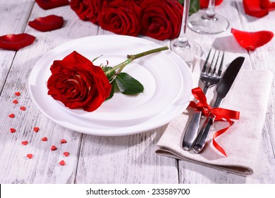 Beautiful Romantic Table Setting With Red Roses Close-up