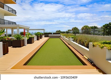 Beautiful Rooftop Terrace Bocce Ball Court With Artificial Turf On Singer Island, Florida At A Condominium Complex.