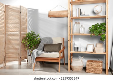 Beautiful room interior with cozy wooden furniture and home decor - Shutterstock ID 2259353349