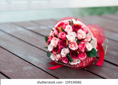 Beautiful Rose Bouquet On Wood Floor