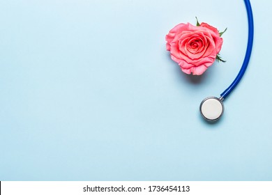 Beautiful Rose Heart And Stethoscope On Blue Background. Thank You Doctor And Nurse Day Concept.