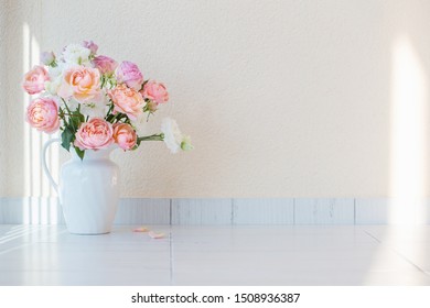 Beautiful Roses In Ceramic White Jug