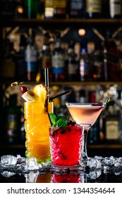 Beautiful Row Line Of Three Different Colored Alcohol Cocktails On Bar In Nightclub Copyspace