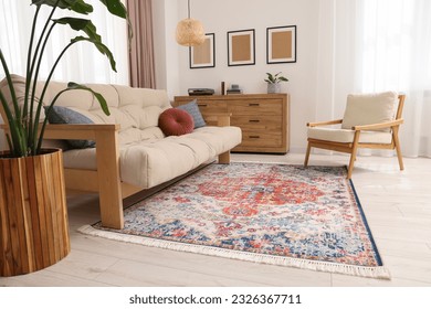 Beautiful rug, sofa, armchair and chest of drawers indoors