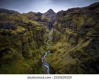 Beautiful rugged landscape at Mulagljufur canyon with cascading waterfalls, river and mossy rocks in Iceland - Powered by Shutterstock