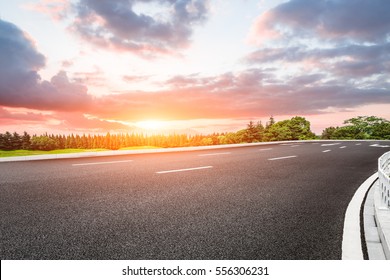 Beautiful Rural Asphalt Road Scenery At Sunset