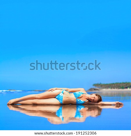 Beautiful russian girl at the beach at a sunny day