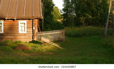 Beautiful rustic summer landscape. Old wooden log houses. Vologda region