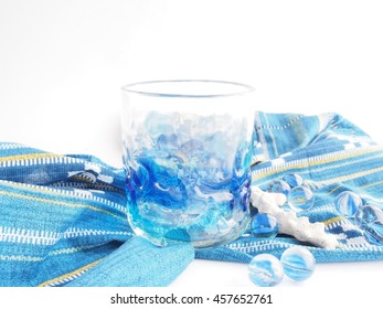 Beautiful Ryukyu(Okinawa) glass, traditional cloth, blue marbles, white coral on white bright  background - Shutterstock ID 457652761