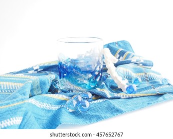 Beautiful Ryukyu(Okinawa) glass, traditional cloth, blue marbles, white coral on white bright  background - Shutterstock ID 457652767