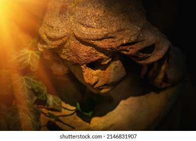 Beautiful Sad Angel Statue In Sunlight. Close Up.