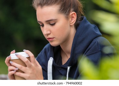 Beautiful Sad Depressed Girl Teenager Female Young Woman Drinking Takeaway Coffee Outside 