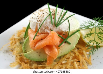 Beautiful Salmon And Poached Egg Stack On A Hash Brown With Avocado.